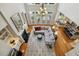 A stylish living room with hardwood floors, fireplace, large windows, and an open floor plan at 321 Wescott Ridge Dr, Holly Springs, NC 27540