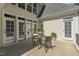 Charming patio with a table and chairs is surrounded by manicured landscaping at 321 Wescott Ridge Dr, Holly Springs, NC 27540