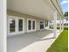 Covered patio with white pillars, offering a serene outdoor living space at 323 Flourishing Street, Sanford, NC 27330