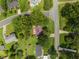 A bird's eye view of a home, surrounded by mature trees and manicured lawns in a quiet, residential neighborhood at 516 Ivey Rd, Graham, NC 27253