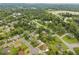 A beautiful aerial shot of a residential area showcasing tree-lined streets, green lawns, and varied home styles at 516 Ivey Rd, Graham, NC 27253