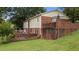 Exterior of a house with a spacious backyard and a brick patio at 516 Ivey Rd, Graham, NC 27253