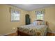Cozy bedroom featuring a bed, two windows and light yellow walls at 516 Ivey Rd, Graham, NC 27253