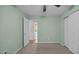 Bedroom with a ceiling fan and closet with open door to bathroom at 516 Ivey Rd, Graham, NC 27253