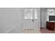 Entryway features a charming door with decorative accents, leading into the interior of the home at 516 Ivey Rd, Graham, NC 27253