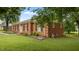 A beautiful brick home with well-maintained landscaping and healthy green lawn at 516 Ivey Rd, Graham, NC 27253