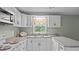Charming kitchen with window view, bright lighting and lots of cabinet space at 516 Ivey Rd, Graham, NC 27253