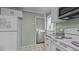 Kitchen featuring white appliances, white cabinets and access to outdoors at 516 Ivey Rd, Graham, NC 27253