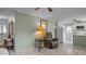 This living room features a cozy chair and leads into a kitchen with updated appliances at 516 Ivey Rd, Graham, NC 27253
