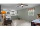 Cozy living room featuring green paneled walls, tile floor and comfortable seating at 516 Ivey Rd, Graham, NC 27253