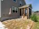 The backyard features a screened-in porch and a stone patio area at 5215 Goshawk Ln, Graham, NC 27253