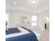 Bright bedroom with a tray ceiling and light hardwood floors at 5215 Goshawk Ln, Graham, NC 27253