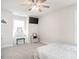 Cozy bedroom features a ceiling fan, a vanity, and plush carpet at 5215 Goshawk Ln, Graham, NC 27253