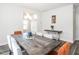 Spacious dining room featuring stylish table with seating for eight and modern chandelier at 5215 Goshawk Ln, Graham, NC 27253