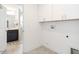 Laundry room with cabinets and a washer/dryer hookup at 5215 Goshawk Ln, Graham, NC 27253