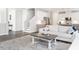 Bright living room with a modern design, gray floors, and a stylish rug at 5215 Goshawk Ln, Graham, NC 27253