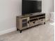 Living Room featuring modern entertainment center with wooden finish at 5215 Goshawk Ln, Graham, NC 27253