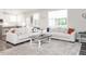 Comfortable living room with open floorplan, stylish furniture, and natural light at 5215 Goshawk Ln, Graham, NC 27253