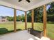 Enjoy the scenic views from this screened-in porch overlooking a large lawn at 5215 Goshawk Ln, Graham, NC 27253
