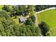 An aerial view of a charming home with mature trees on a spacious lot and is near to the road at 545 Barnette Rd, Louisburg, NC 27549