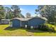 Backyard view of a cozy home with lawn at 545 Barnette Rd, Louisburg, NC 27549