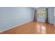Comfortable bedroom with natural light, hardwood floors, and cozy ambiance at 545 Barnette Rd, Louisburg, NC 27549