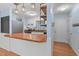 Modern kitchen with sleek appliances, counter seating, and open shelving at 545 Barnette Rd, Louisburg, NC 27549