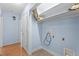 Blue laundry room featuring utility connections and storage shelves at 545 Barnette Rd, Louisburg, NC 27549