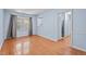 Inviting living room with natural light, hardwood floors, and view of kitchen and dining room at 545 Barnette Rd, Louisburg, NC 27549