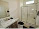 Bathroom features a vanity with marble countertop and tiled shower with glass doors at 555 Hinnant Rd, Selma, NC 27576