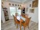 Cozy dining room with a wooden table, matching chairs, and a Tiffany-style light fixture at 555 Hinnant Rd, Selma, NC 27576