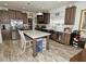 Beautiful kitchen with dark wood cabinets, a large kitchen island and stainless steel appliances at 555 Hinnant Rd, Selma, NC 27576
