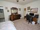 Spacious main bedroom with a cozy bed, dresser, desk, and carpet flooring at 555 Hinnant Rd, Selma, NC 27576