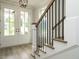 Inviting entryway features wood-look floors, staircase and a light-filled double front door at 1221 Barreto Dr, Wendell, NC 27591