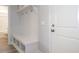 Mudroom features built-in shelving and bench storage near an exterior door at 1221 Barreto Dr, Wendell, NC 27591