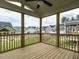 Relaxing screened porch with wood floors and a view of the backyard and surrounding neighborhood at 1221 Barreto Dr, Wendell, NC 27591