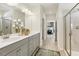 Modern bathroom featuring double vanity, framed mirror, and glass shower doors at 1234 Sirius Lot 6 Dr, Sanford, NC 27330