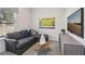Cozy living room featuring a comfortable gray sectional sofa, a modern TV, and natural light from the window at 1234 Sirius Lot 6 Dr, Sanford, NC 27330