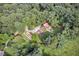 Secluded property with lush trees, garden, and a serene outdoor dining area at 133 Acorn Ln, Pittsboro, NC 27312