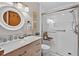 Updated bathroom featuring a glass-enclosed shower with a built-in seat and modern vanity at 133 Acorn Ln, Pittsboro, NC 27312