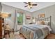 Comfortable bedroom with a large window offering natural light and a view of the outdoors at 133 Acorn Ln, Pittsboro, NC 27312