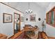 Cozy dining area with hardwood floors, chandelier lighting, and access to the kitchen at 133 Acorn Ln, Pittsboro, NC 27312