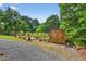 Well-kept backyard garden with a wooden shed and raised garden beds at 133 Acorn Ln, Pittsboro, NC 27312
