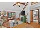 Inviting living room with vaulted ceiling, cozy fireplace, and access to outdoor patio at 133 Acorn Ln, Pittsboro, NC 27312