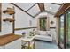 Comfortable living room area in a tiny home, featuring a sofa, table, and bright decor at 133 Acorn Ln, Pittsboro, NC 27312