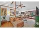 Cozy living room featuring comfortable sofa, hardwood floors, and access to the covered back porch at 133 Acorn Ln, Pittsboro, NC 27312