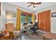 Functional home office with a window view, desk, closet storage and comfortable sitting area at 133 Acorn Ln, Pittsboro, NC 27312