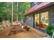 Relaxing outdoor patio with lounge chairs and sliding glass doors, ideal for enjoying the serene surroundings at 133 Acorn Ln, Pittsboro, NC 27312