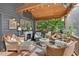 Relaxing screened porch with comfortable seating and view to private backyard at 133 Acorn Ln, Pittsboro, NC 27312