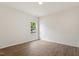 Bright bedroom with hardwood floors and a sunlit window at 1408 South St, Durham, NC 27707